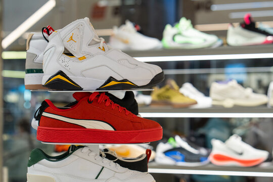 Sports shoes are sold in the store. Sneakers of various brands including Air Jordan and PUMA, are on the shelves. Minsk, Belarus - March 30, 2026