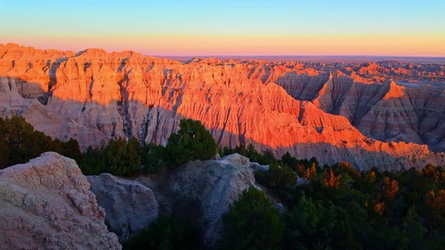 Scenic aerial view of colorful sunset over Badlands National Park from the Pinnacles viewpoint, South Dakota
