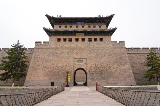 Front view of the historic Heyang gate tower and wooden bridge at Datong ancient city wall, Shanxi, China