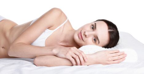 Obraz premium Woman lying on bed with orthopedic pillow against white background