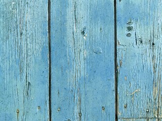 Fototapeta premium Old wooden wall with peeling paint.