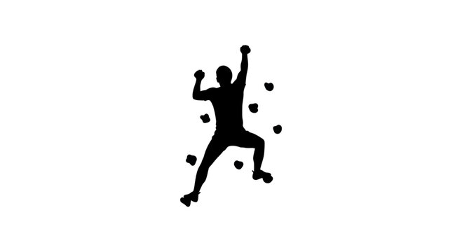 Silhouette of a person rock climbing on a climbing wall with holds