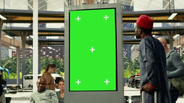 Chroma key screen in busy bus station with diverse people using convenient bus connections and mass transit services across the metropolitan area. Commercial route at rush hour.