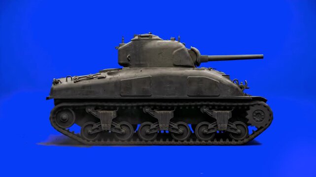 A side profile view of a classic US Army medium battle tank with rounded cast hull architecture and moving tracks. The detailed historical 3D model with aged iron textures is rendered on a clear chrom
