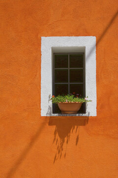 Window in Orange Building in Orgosolo Italy