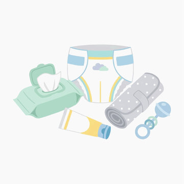 Baby care essentials including diaper wipes cream and rattle on white background
