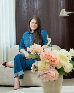 Fashion Lifestyle Portrait of Woman in Denim with Floral Foreground