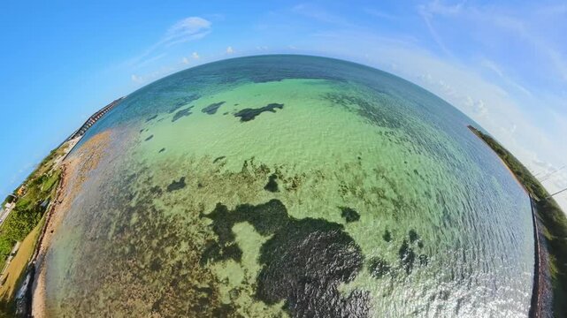 Aerial extreme pov fisheye droen video flying over reefs in the Florida Keys 2026