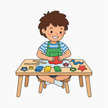Cute boy playing with colorful modeling clay and cookie cutters at a table