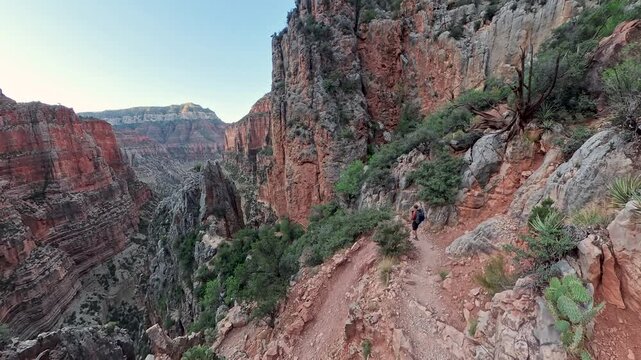 Man Winds Down Trail into the Grand Canyon on the North Kaibab Trail