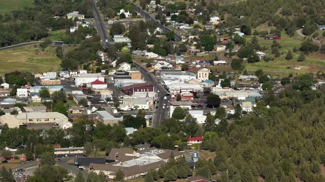 Aerial zoom shot of small town John Day in Oregon in spring time