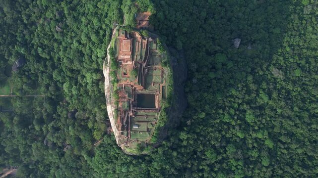 Aerial drone footage of Lion Rock in the city of Sigiriya in Sri Lanka on a sunny day, 4k 30fps, 1 inch sensor