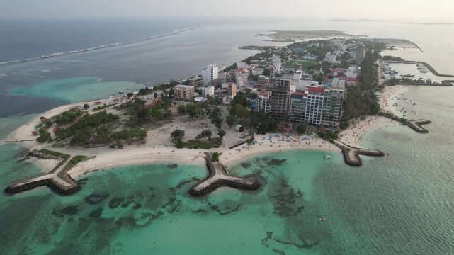 Aerial footage of Maafushi beaches in the Maldives atoll on a sunny day, 4k 30fps, 1 inch sensor drone