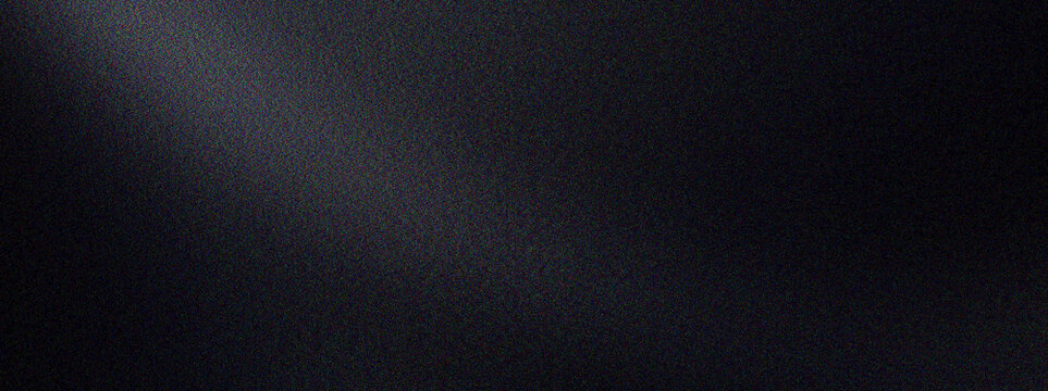 Dark abstract background with subtle spotlight effect and fine grain texture providing a minimalist and moody ambiance for design compositions.