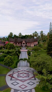 Aerial top down drone video of traditional Minangkabau geometric garden pattern at rumah gadang complex in West Sumatra, Indonesia