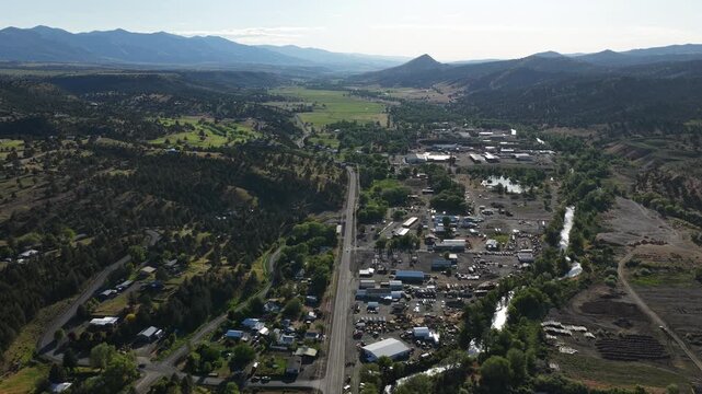 High wide aerial of John Day Oregon small town in spring time