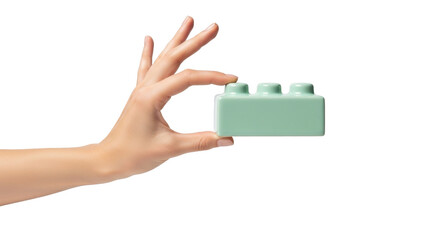 Obraz premium Hand holding mint green LEGO brick