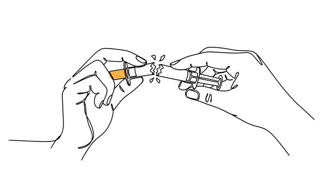 Hands breaking a cigarette, symbolizing quitting smoking and healthy lifestyle choice