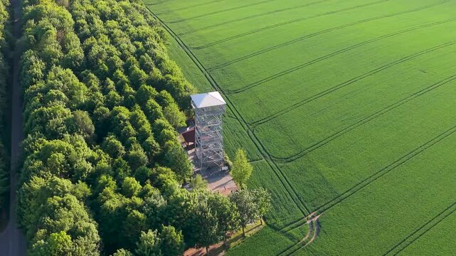 Aerial drone view of observation tower in Pietrowice Wielkie surrounded by farmland