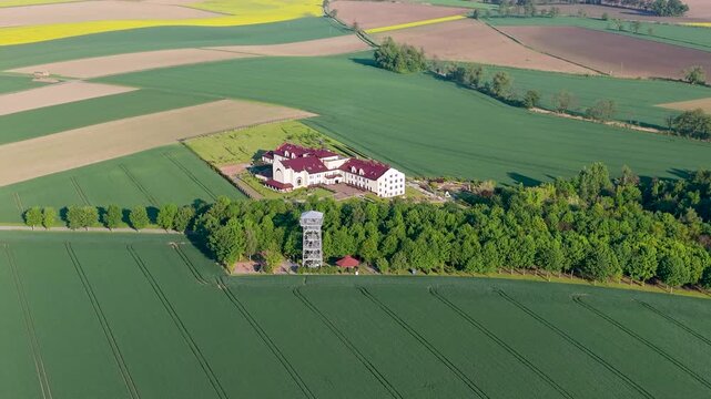 Aerial drone view of observation tower in Pietrowice Wielkie surrounded by farmland
