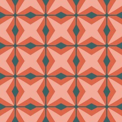 Fototapeta premium A pattern of red and green squares. The squares are arranged in a diamond shape