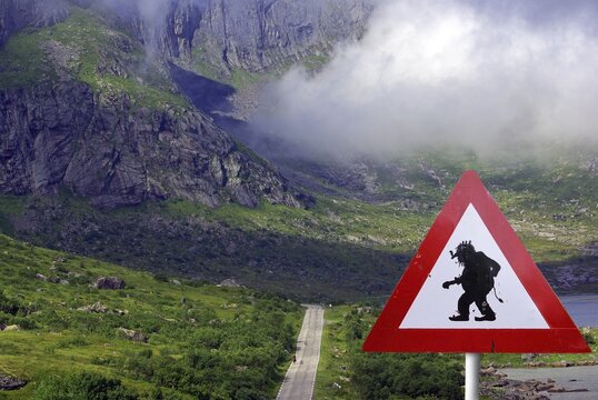 AChtung Trolls, road sign, Nordic landscape with road, Trollstigen Scandinavia, Norway