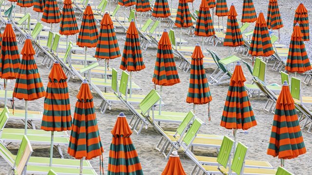 Sunbeds and umbrellas at the beach di Fegina in Monterosso al Mare, Cinque Terre, Ligurian Coast, Liguria, Italy