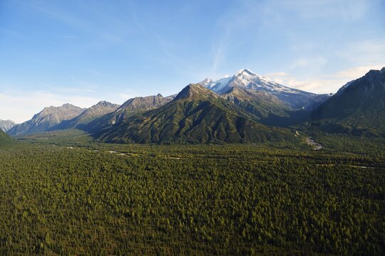 Wide forested valley with mountain peaks, Lake Clark National Park, Alaska, USA