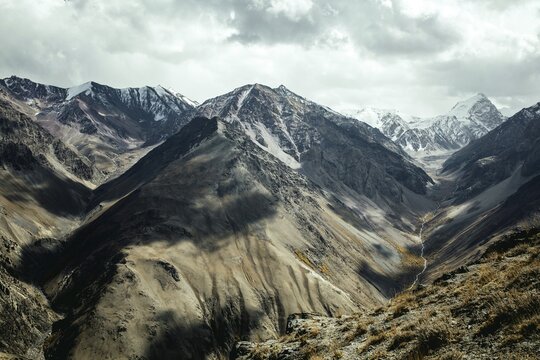 Daliz Pass, scree landscape, behind it summit of the Hindu Kush, Wakhan Corridor, Badakhshan, Afghanistan