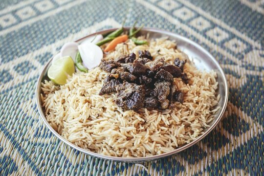 Traditional camel restaurant in Salalah, dry braised camel meat on rice, Dhofar, Oman