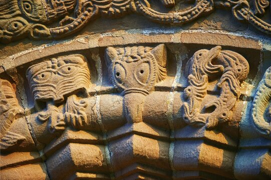 Norman Romanesque relief sculptures of dragons and mythical creatures, circa 1140, South doorway of Church of St Mary and St David, Kilpeck, Herefordshire, England, United Kingdom