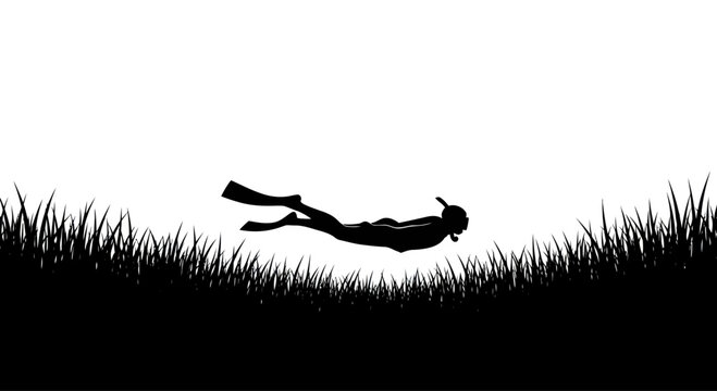 Silhouette of a diver swimming underwater with snorkel and fins