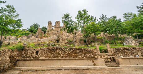 Fototapeta premium The scenic views of Syedra, an ancient port city in the region of ancient Cilicia, Pamphylia, or Isauria in Turkey between Alanya and Gazipaşa, include a temple, a theater, shops, bathhouse, town wall
