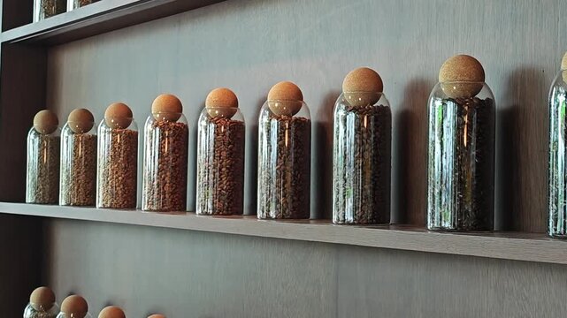 Roasted coffee beans in glass jar.