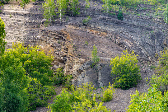 Tectonic compression during Hercynian orogeny folded Lower Carboniferous marine carbonates creating anticlines and synclines