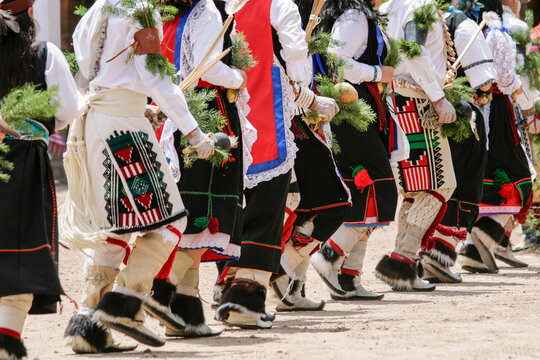 Dancers&rsquo; feet and regalia in motion at a cultural gathering