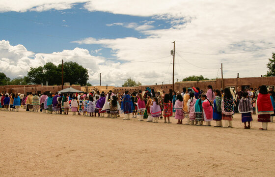 Community dance gathering in a Southwestern pueblo plaza