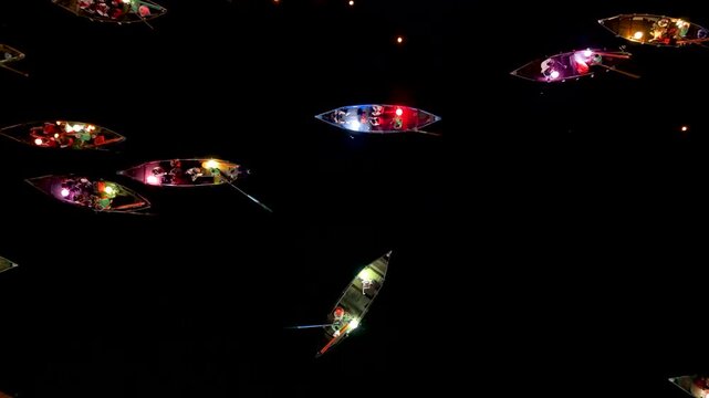 Panorama aerial drone view of Hoi An ancient town with boat tour and beautiful lanterns in night. UNESCO world heritage. One of the most travel popular touristic destinations
