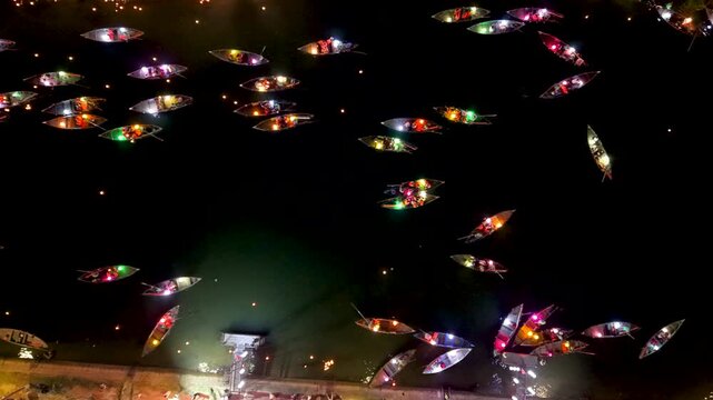 Panorama aerial drone view of Hoi An ancient town with boat tour and beautiful lanterns in night. UNESCO world heritage. One of the most travel popular touristic destinations