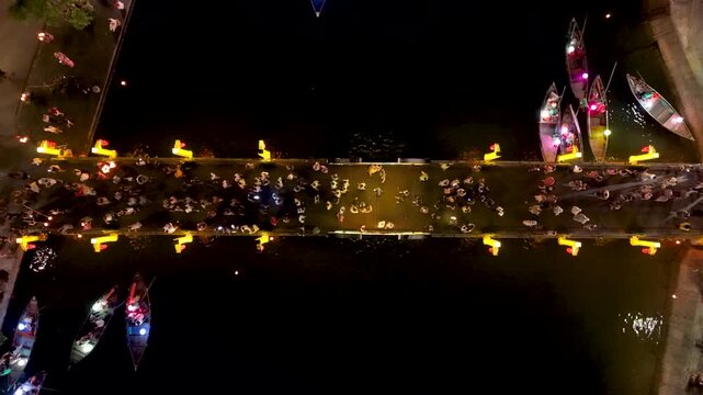 Panorama aerial drone view of Hoi An ancient town with boat tour and beautiful lanterns in night. UNESCO world heritage. One of the most travel popular touristic destinations