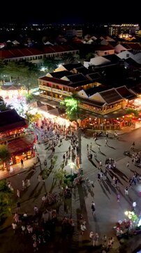 Panorama aerial drone view of Hoi An ancient town with boat tour and beautiful lanterns in night. UNESCO world heritage. One of the most travel popular touristic destinations 