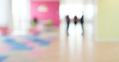 Fototapeta premium A blurred image depicting an indoor space with colorful walls and flooring. The soft focus adds a sense of abstraction, suggesting a lively atmosphere.