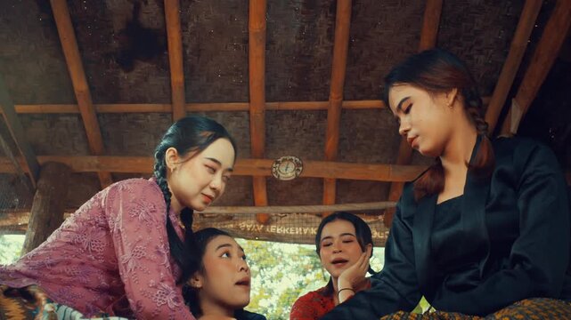 Friends Watching Turn in Traditional Game