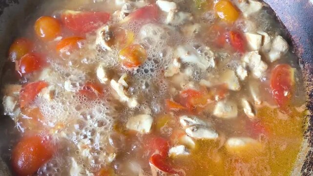 Cooking Tom Kha Gai in pan, Thai famous food.