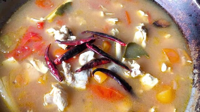 Cooking Tom Kha Gai in pan, Thai famous food.