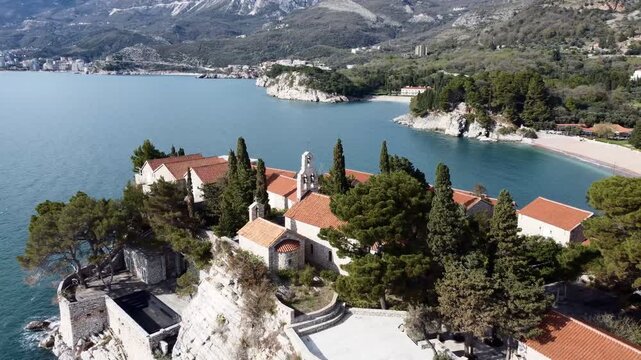 Drone flight aerial view of Sveti Stefan island - hotel. Montenegro, Europe