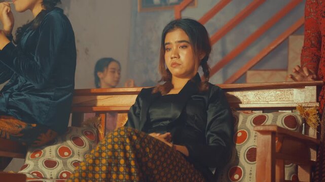 Moody Woman Sitting Alone While Friends Chat