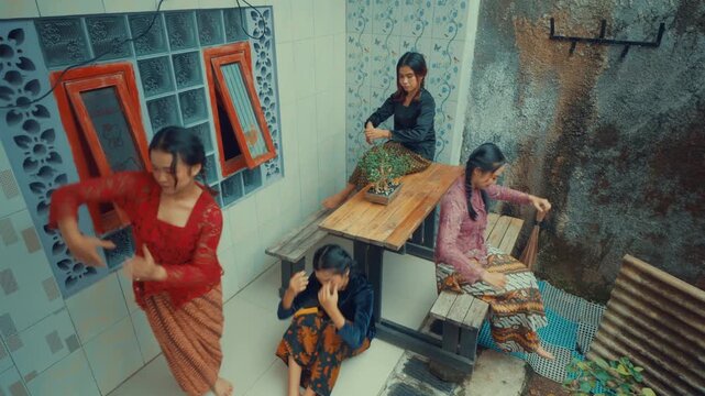 High Angle View of Friends Dancing in Courtyard