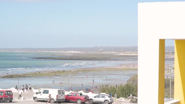 people on the beach, waves, Las Grutas, day