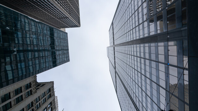 Bottom View of Tall Buildings in Downtown Chicago with Hazy Sky